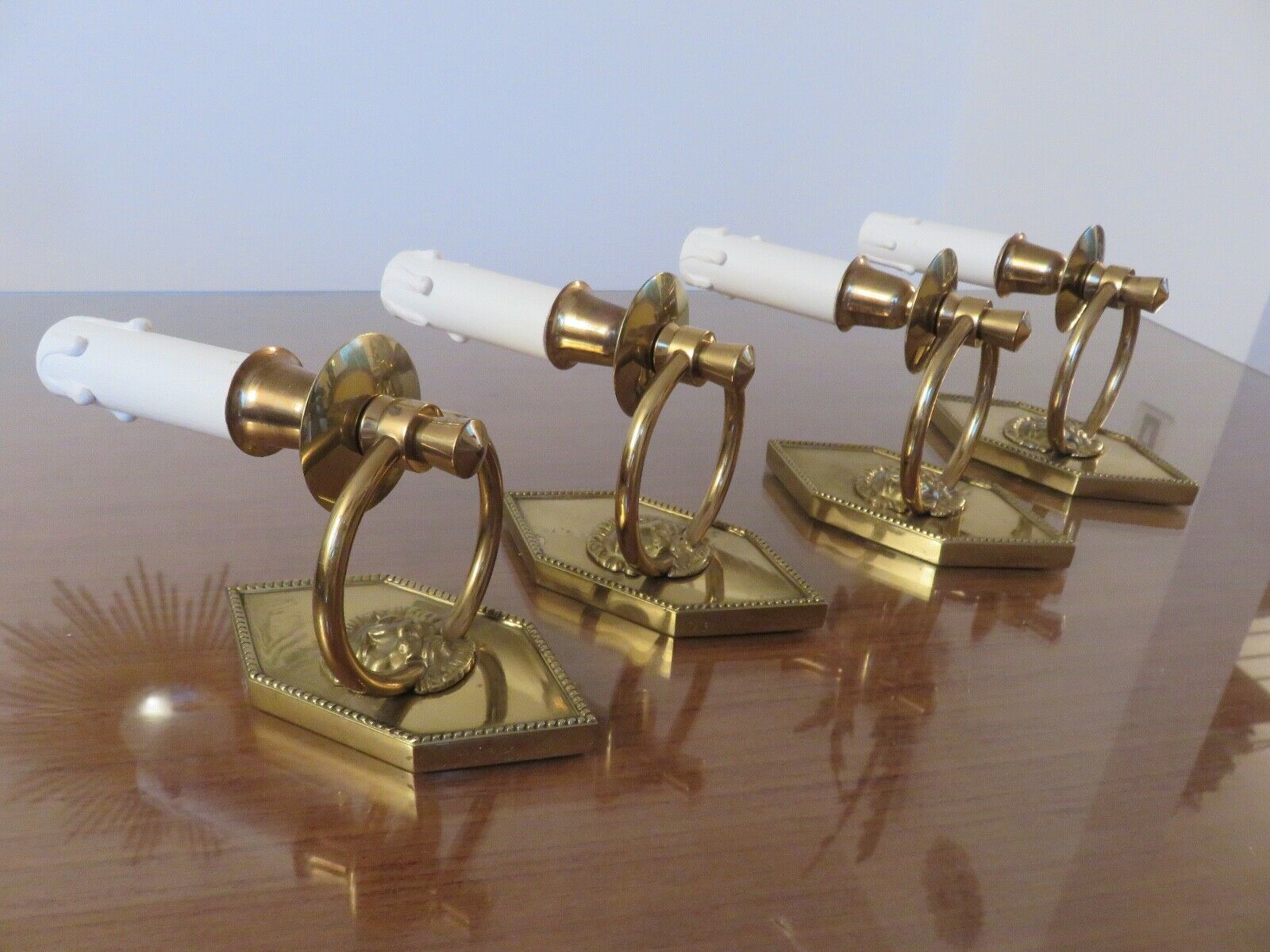 Series of 4 art deco sconces to lions in solid golden brass 40s 50s