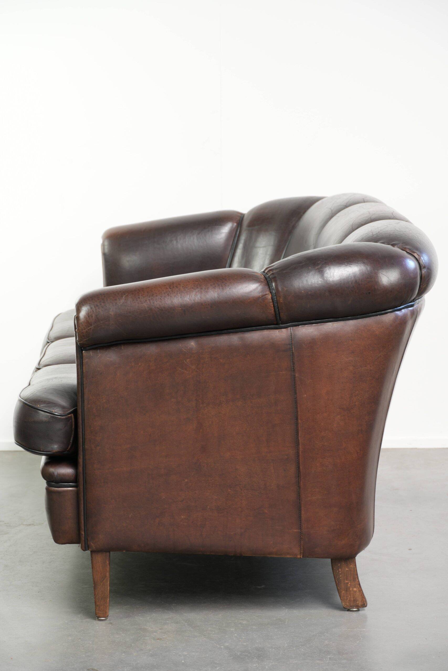 Unique sheepskin 3-seater sofa with deep colours and a distinctive design