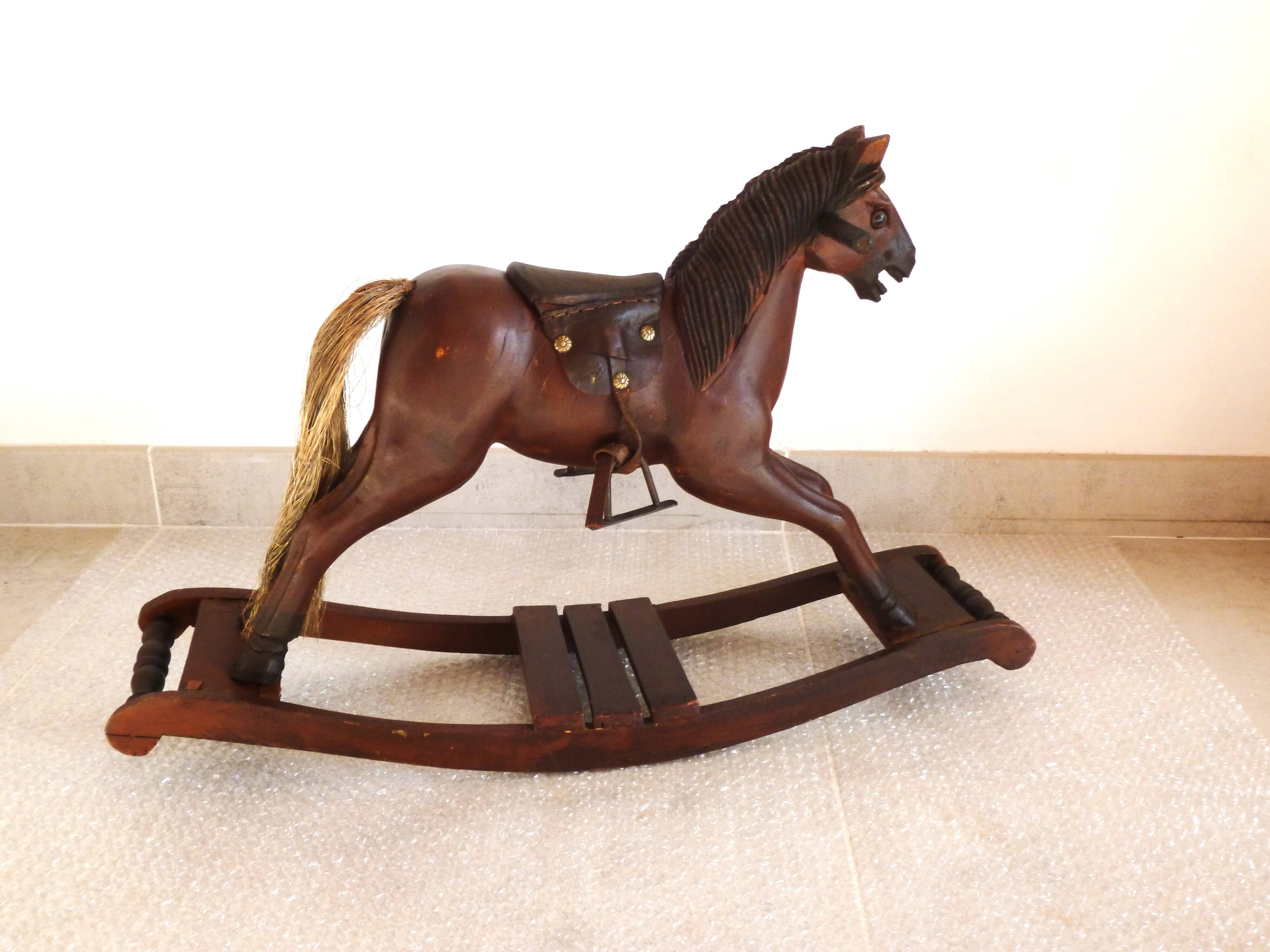 Antique wooden and leather rocking horse