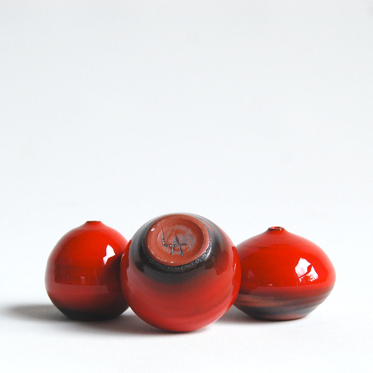 Trio of red ceramics Antonio Lampecco