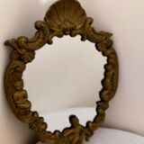 Gilded bronze mirror with angels and scrolls