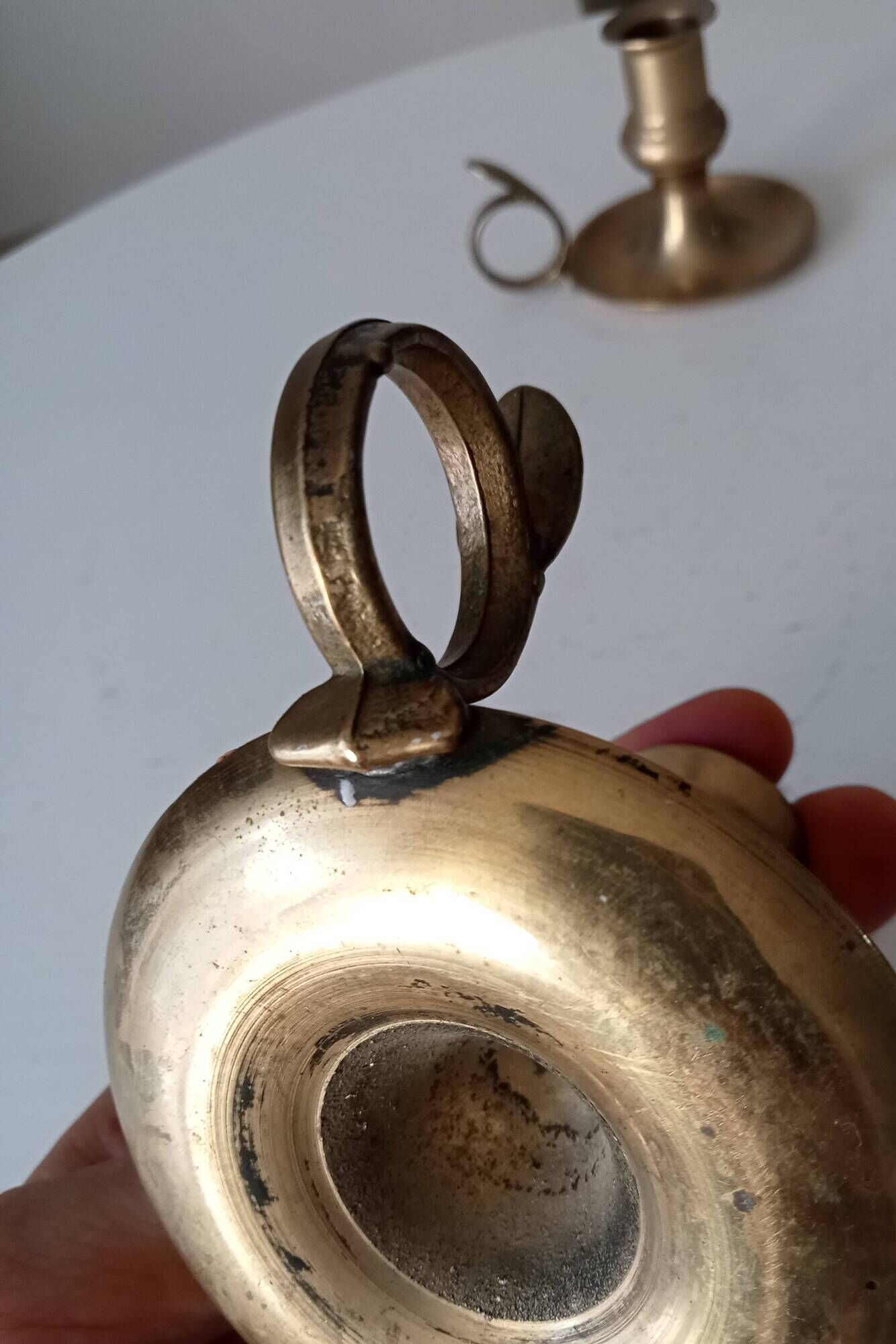 Antique hand candlestick in solid gilded brass.