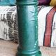 Pedestal column in green ceramic with flower and fruit decoration