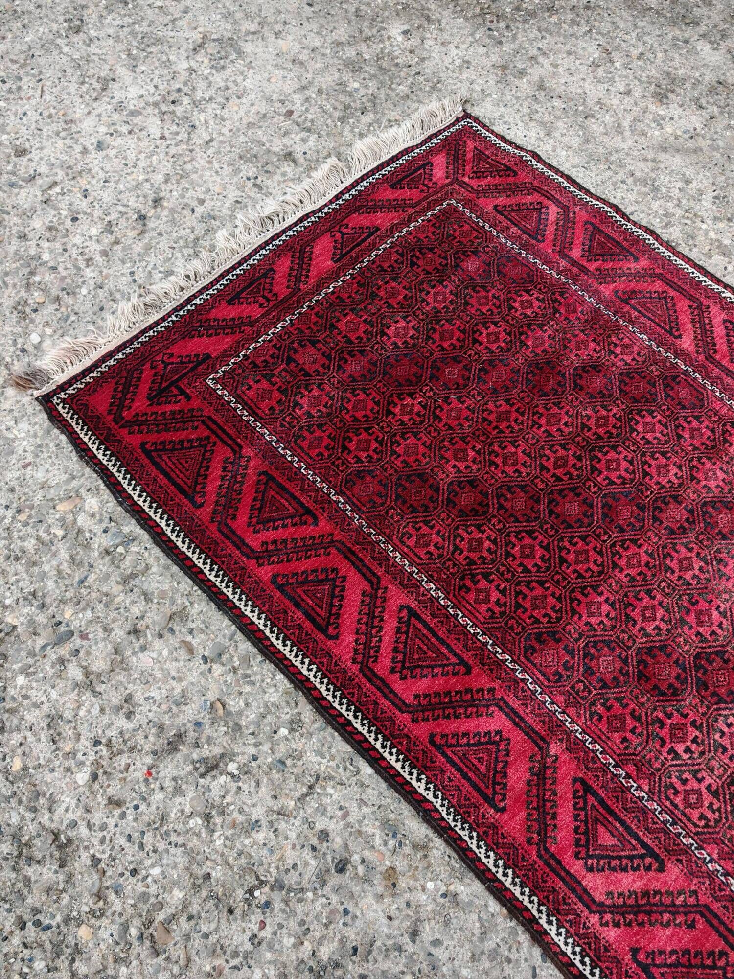Vintage handmade Baluch rug with geometric pattern from the 1950s.