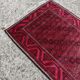 Vintage handmade Baluch rug with geometric pattern from the 1950s.