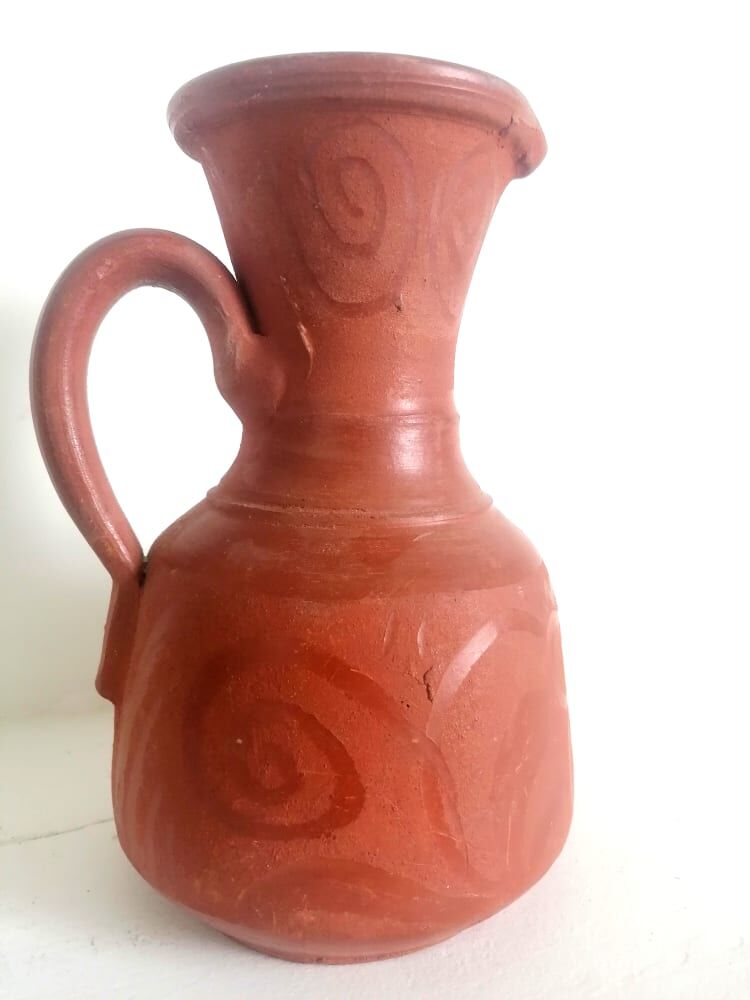 Pitcher in oriental terracotta