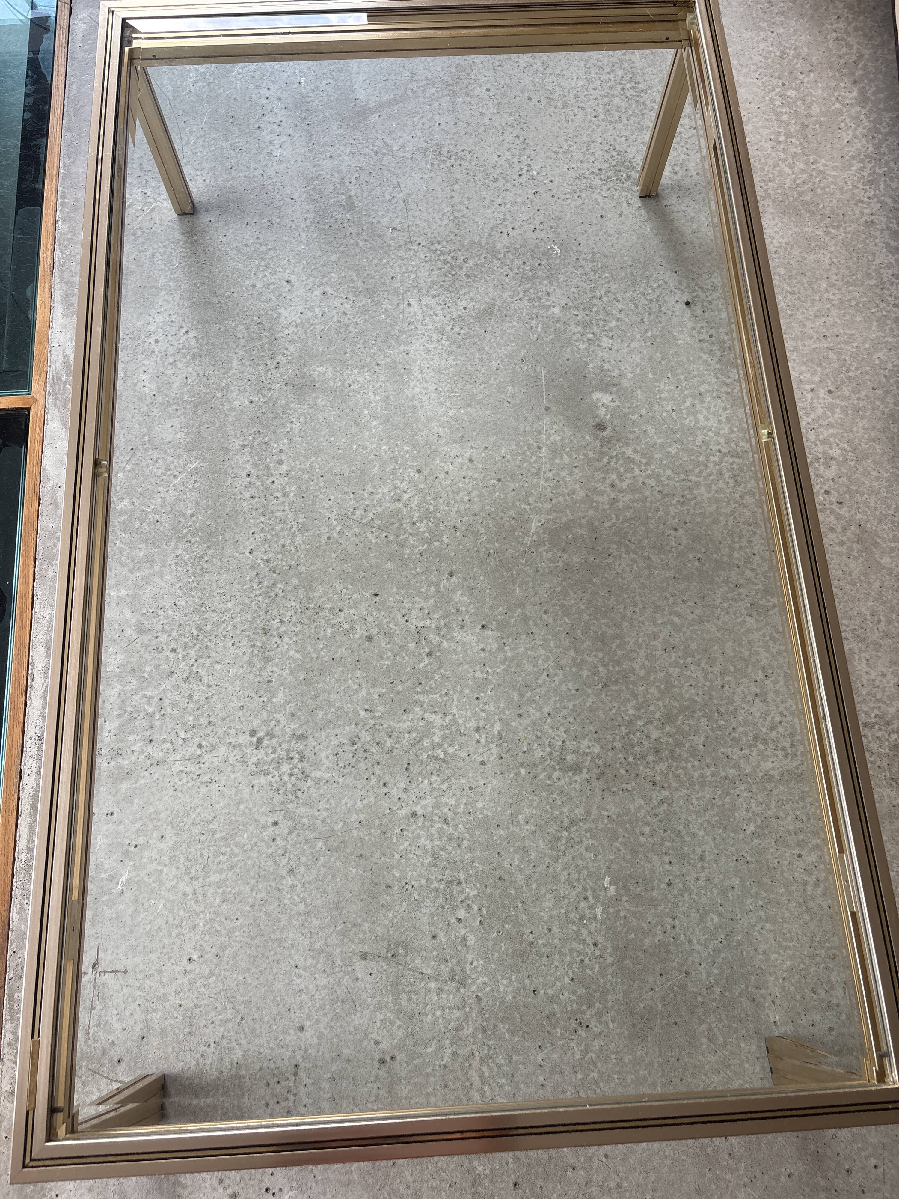 Brass/glass table designed by Pierre Vandel Paris