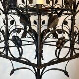 Lustre with 12 lights in wrought iron decorated with clovers and foliage.
