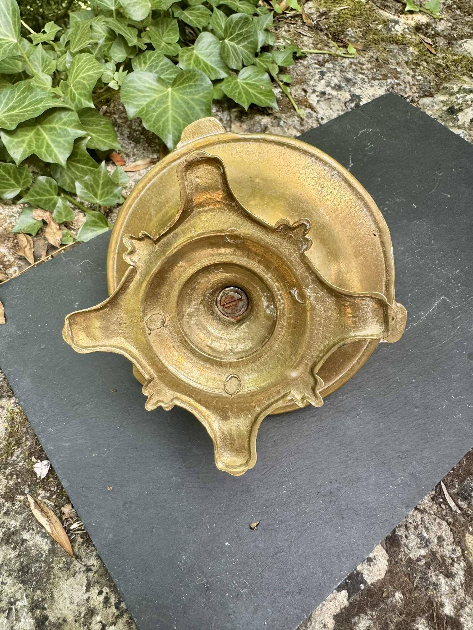 Cherub brass pocket emptier