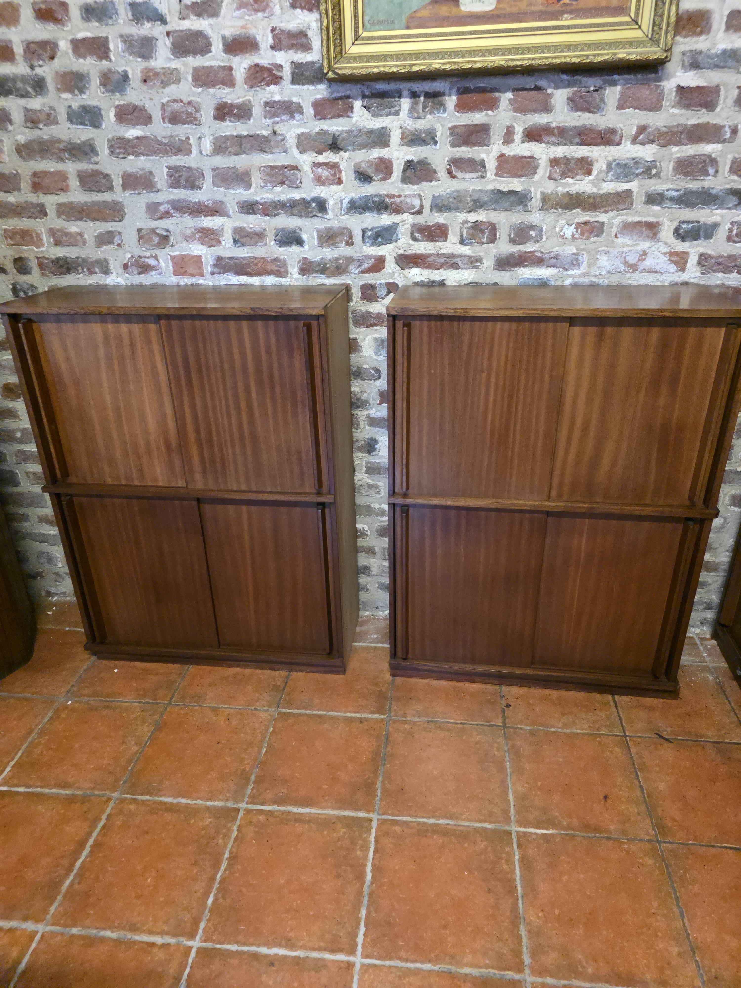Modular corner library Oscar from the 1960s with sliding doors.