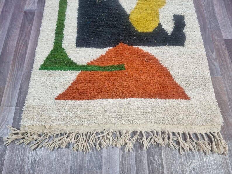 Handmade traditional Moroccan rug with colourful patterns, size 140x260 cm.