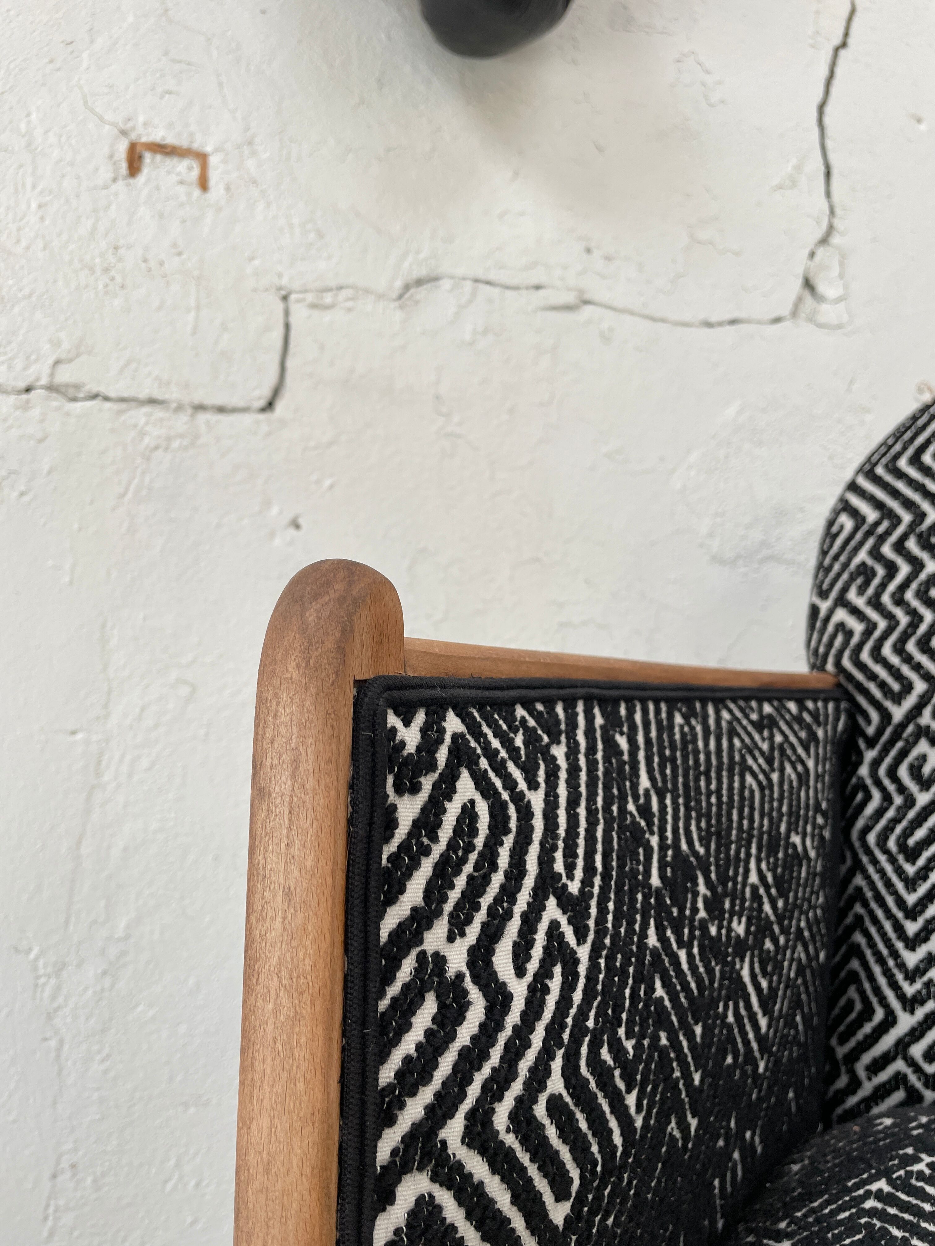 Club armchair in wood and fabric.