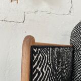 Club armchair in wood and fabric.