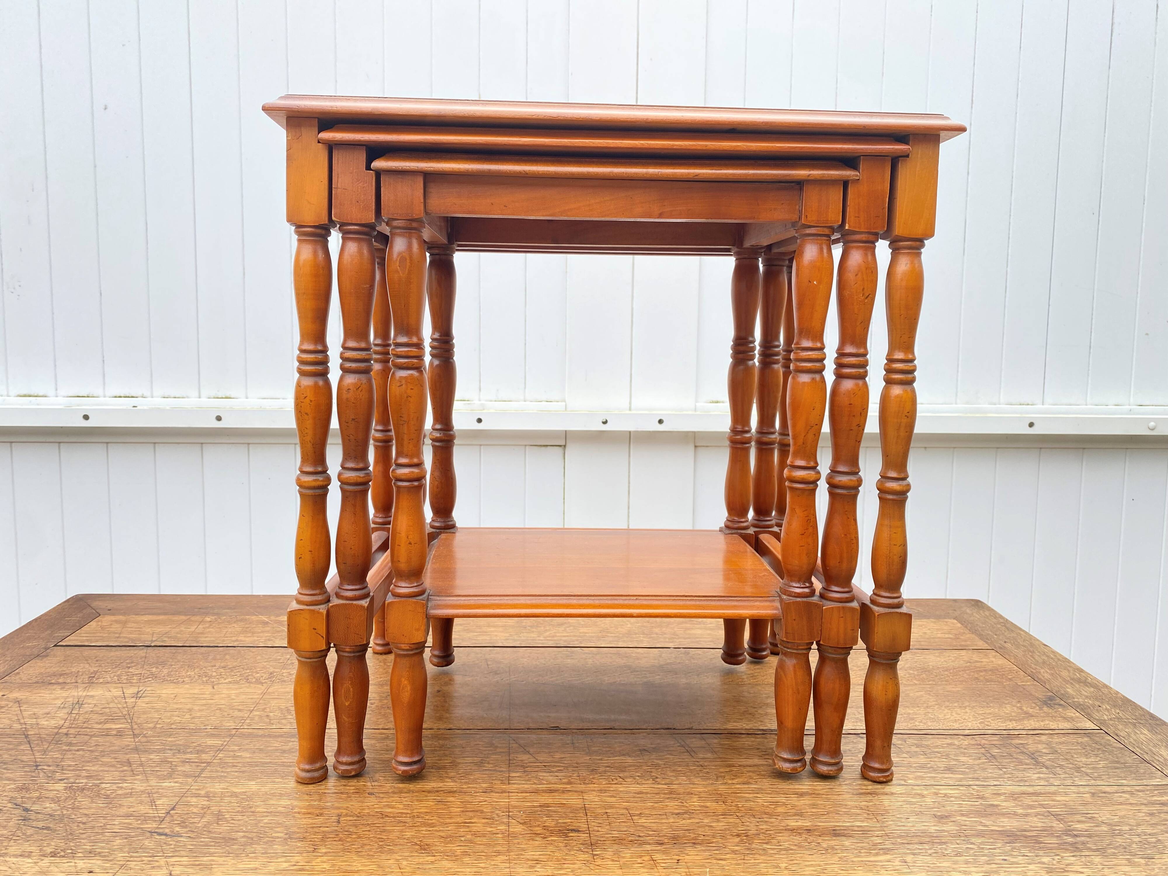 Set of 3 rustic cherry wood nesting coffee tables from the 1950s.