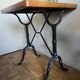 Superb square table made of solid oak from the 1960s, with a cast iron bistro base.