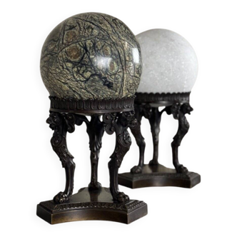Pair of marble spheres on bronze tripods, 19th century