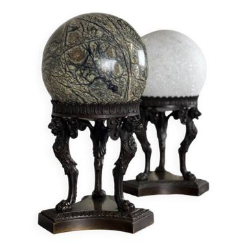 Pair of marble spheres on bronze tripods, 19th century