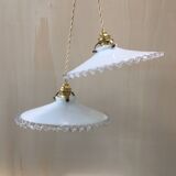 Pair of pendants in white opaline and transparent serrated edges