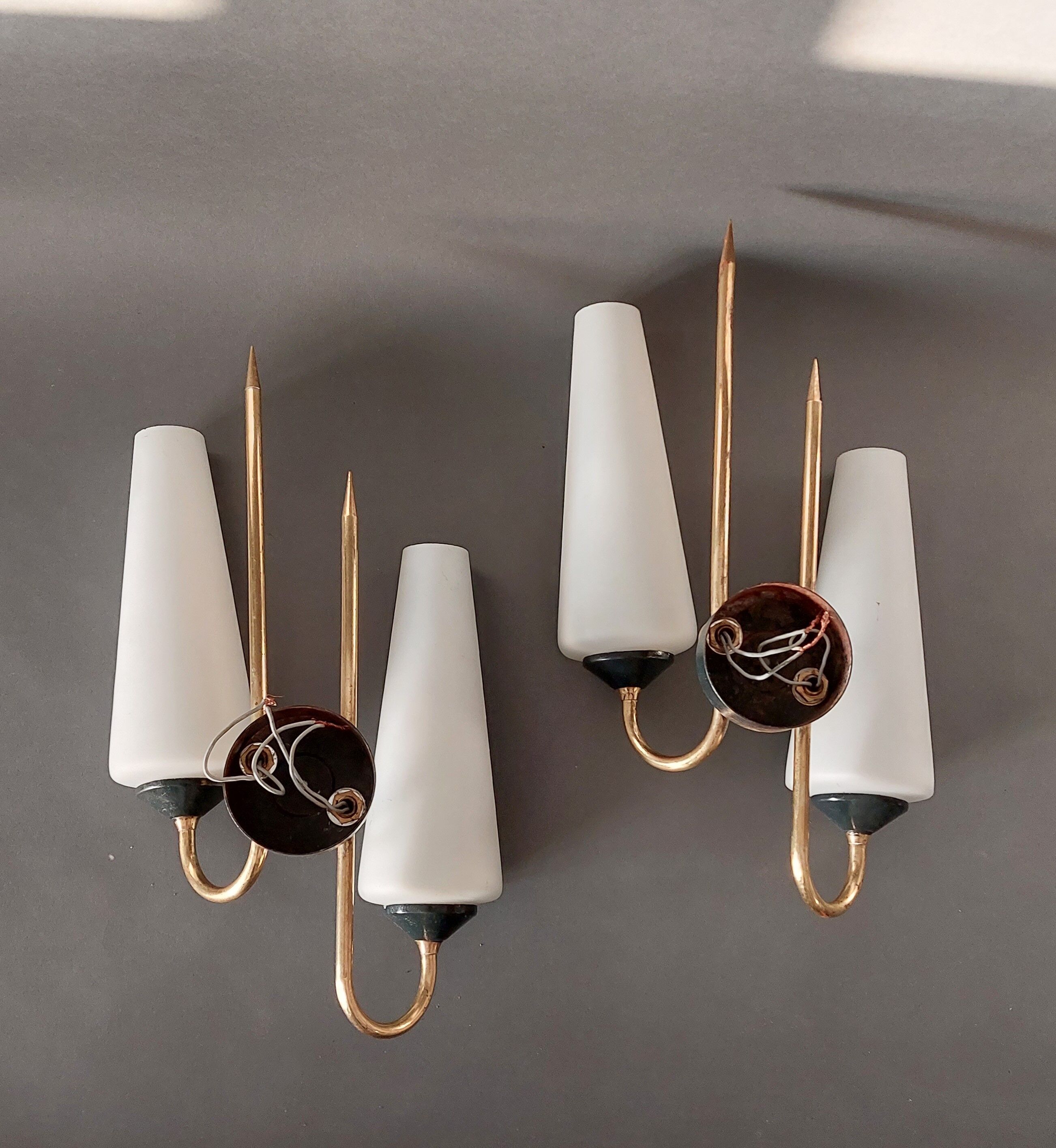Pair of sconces in black metal and gilded brass 1960 Vintage.