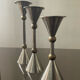 Trio of vintage metal and bronze candle holders