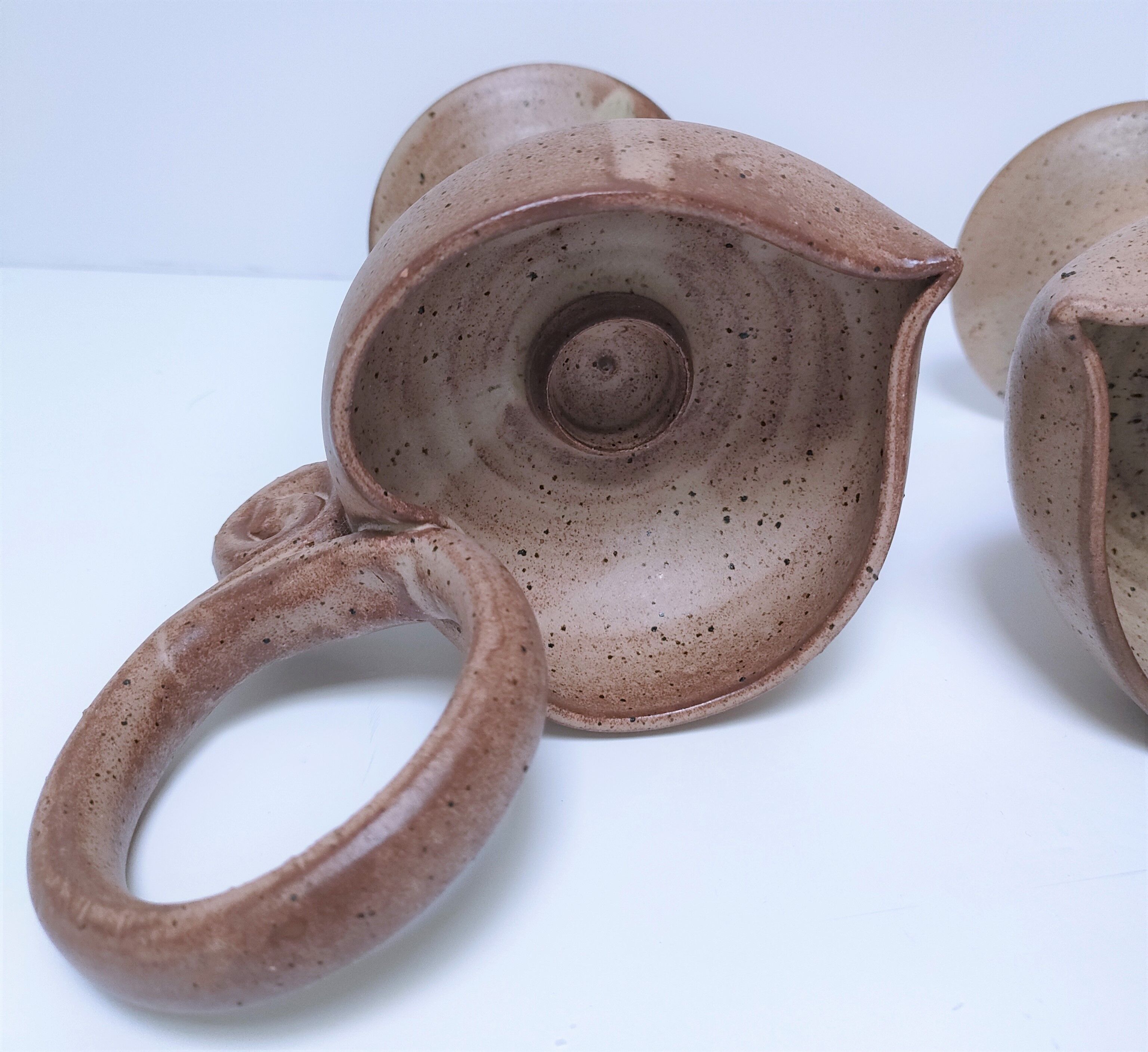 Pair of vintage “heart” sandstone candlesticks