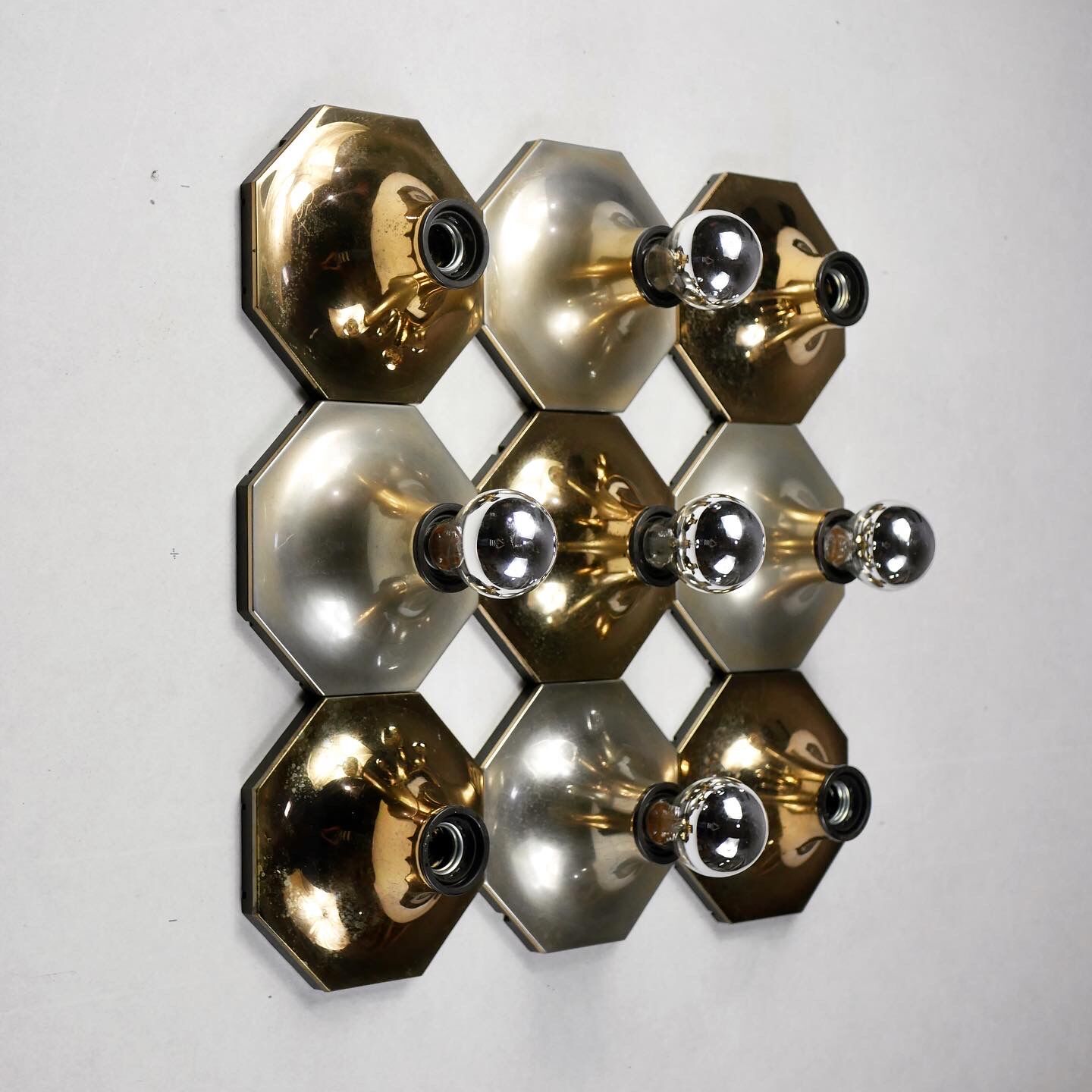 Suite of 11 octagonal brass wall lamps by Motoko Ishii