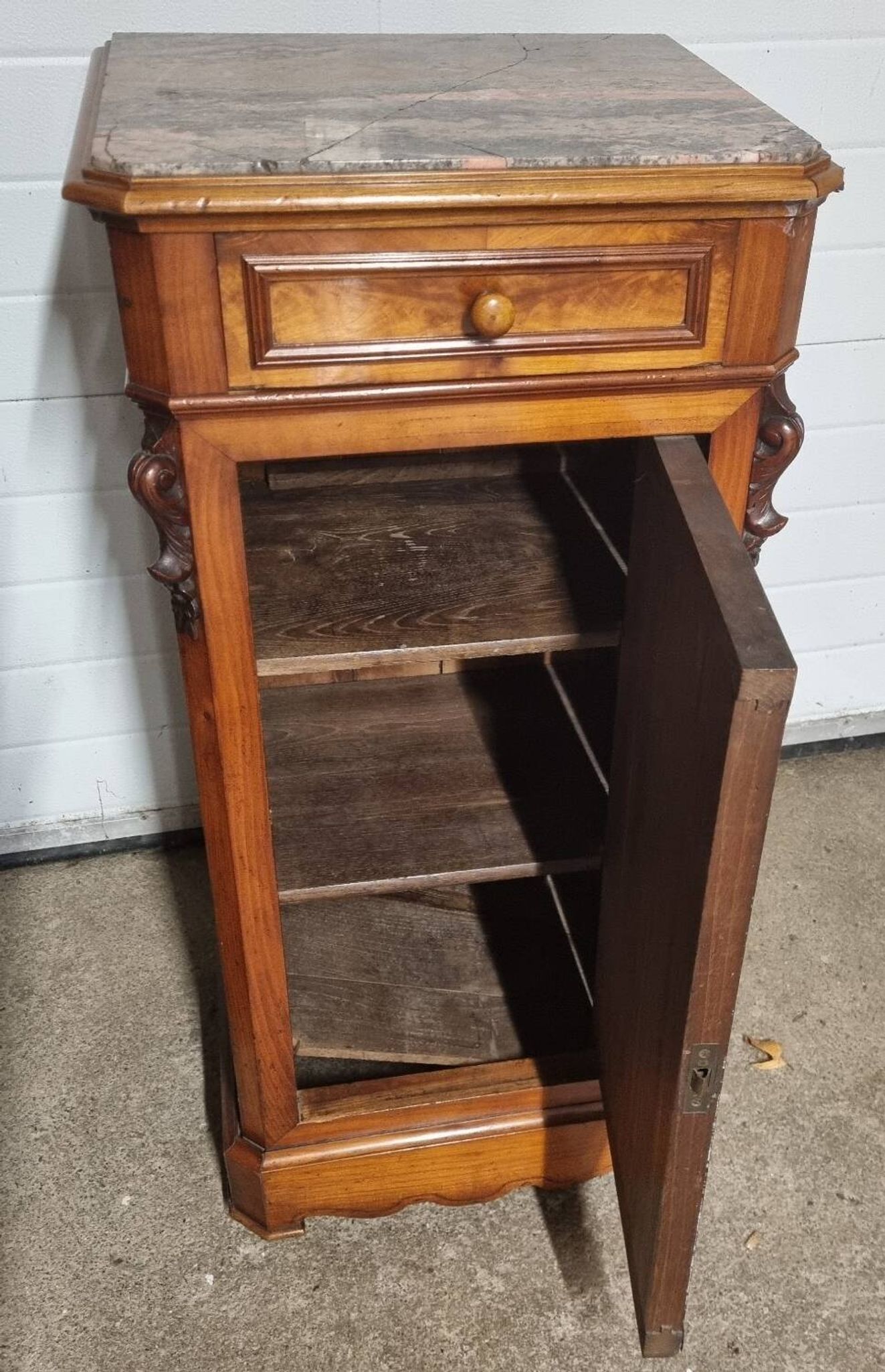 Cherry nightstand with pink marble.