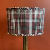 Lamp base in gilded brass, oval silk lampshade with a checkered pattern in burgundy.