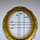 Oval frame in golden resin