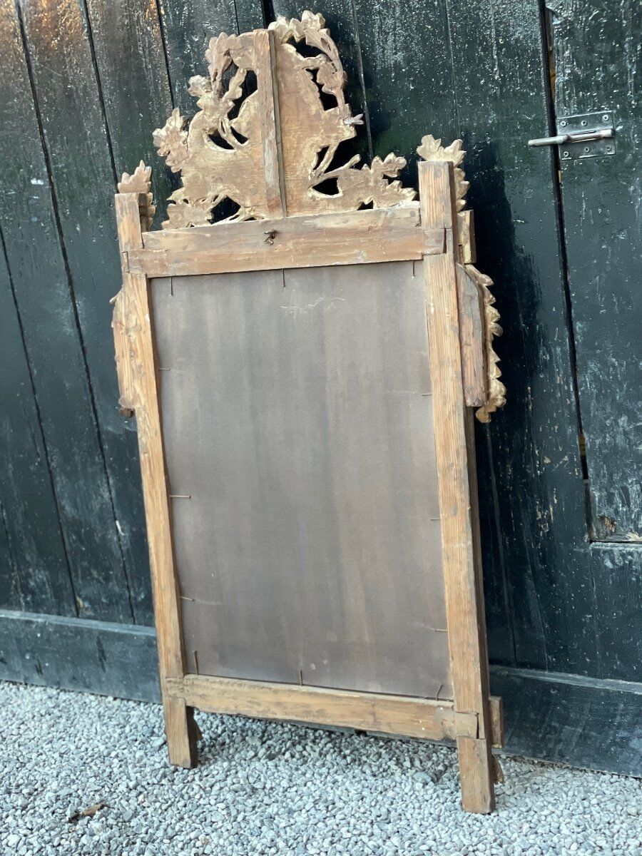 Louis XVI mirror in gilded carved wood, eighteenth century