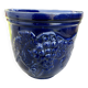 Wall pot in glazed blue terracotta with a grape motif, 1970s.
