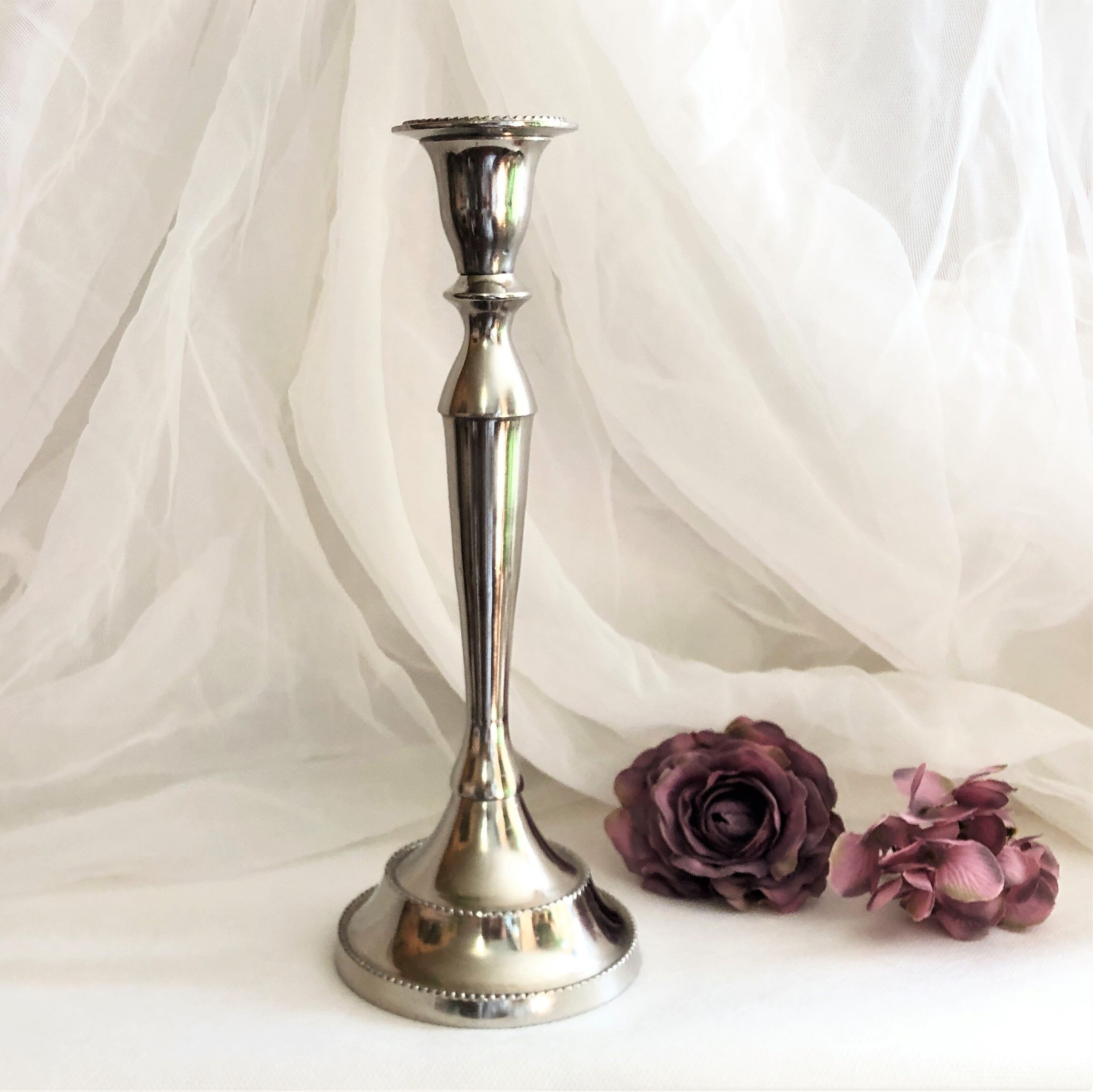 Chromed metal candle holder