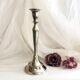 Chromed metal candle holder