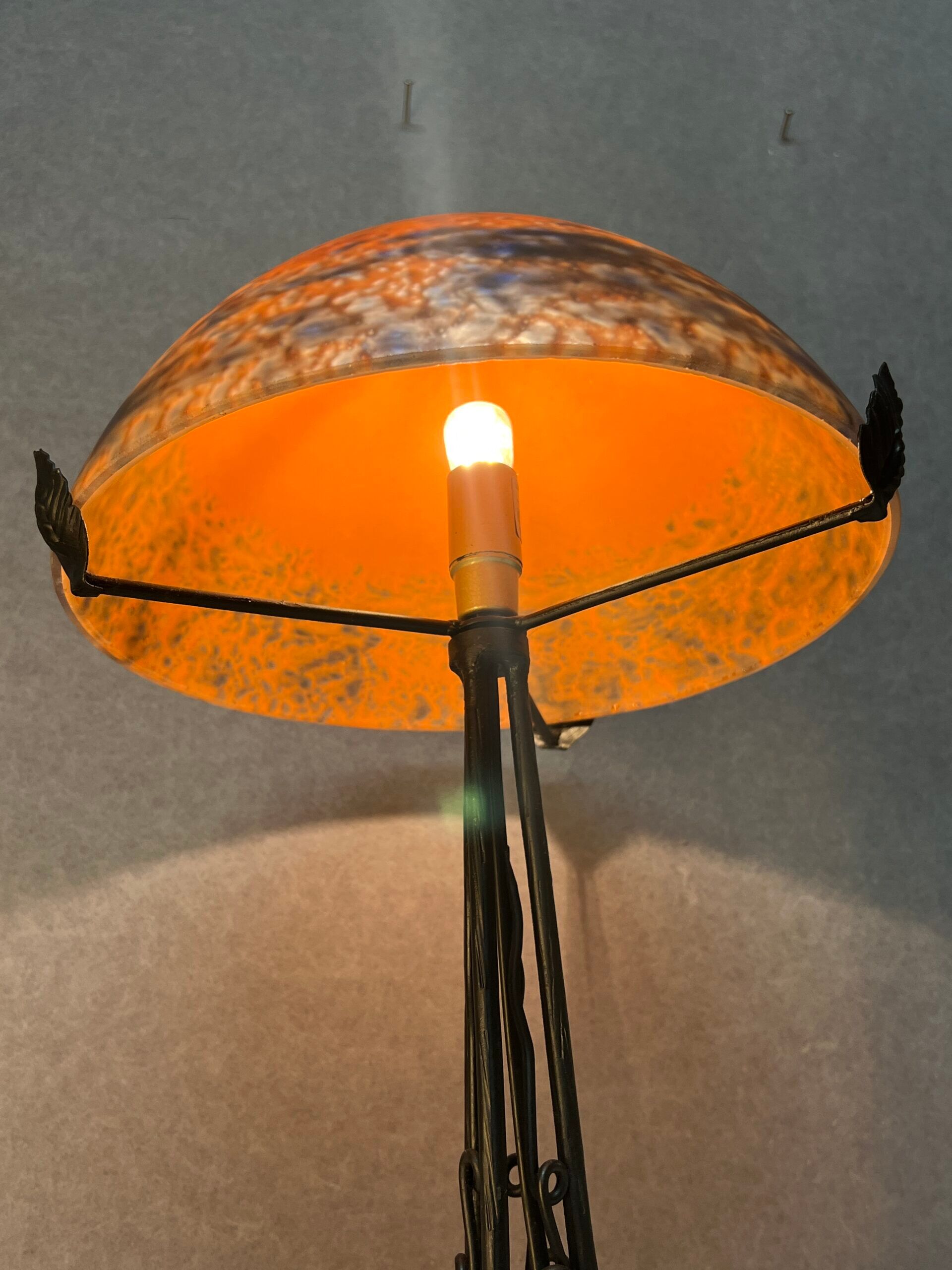 Contemporary mushroom lamp, wrought iron base and shaded orange glass shell