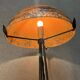Contemporary mushroom lamp, wrought iron base and shaded orange glass shell