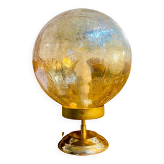 Amber cracked round globe lamp with gold metal.
