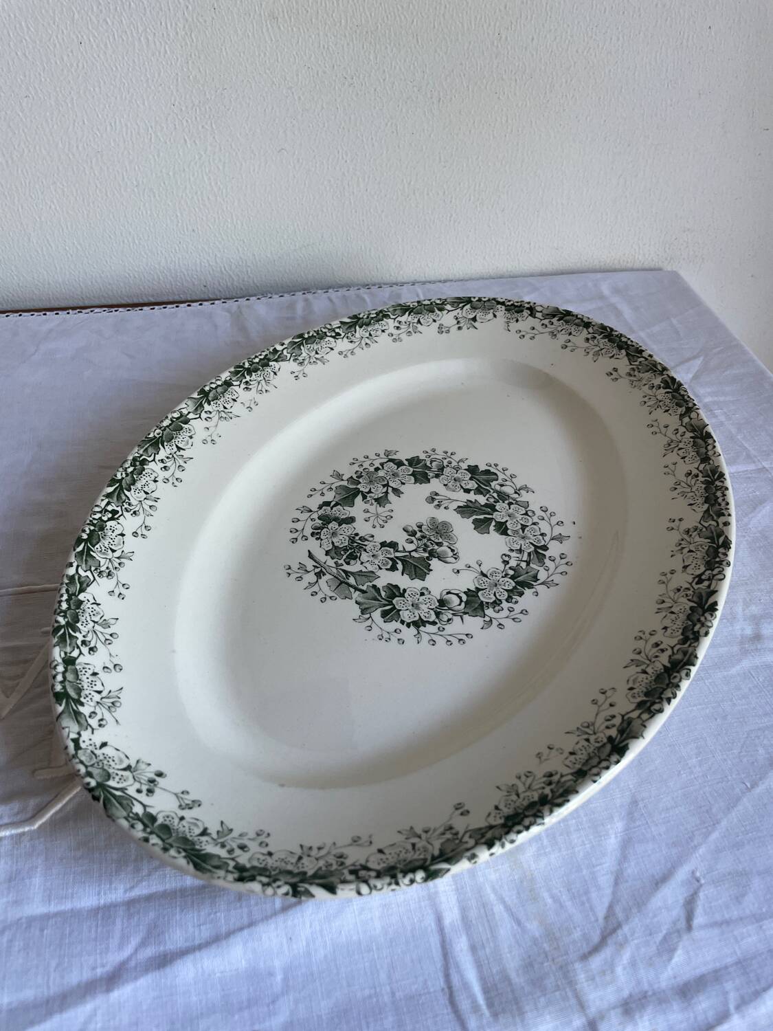 Oval dish with green motorcycles Terre de Fer