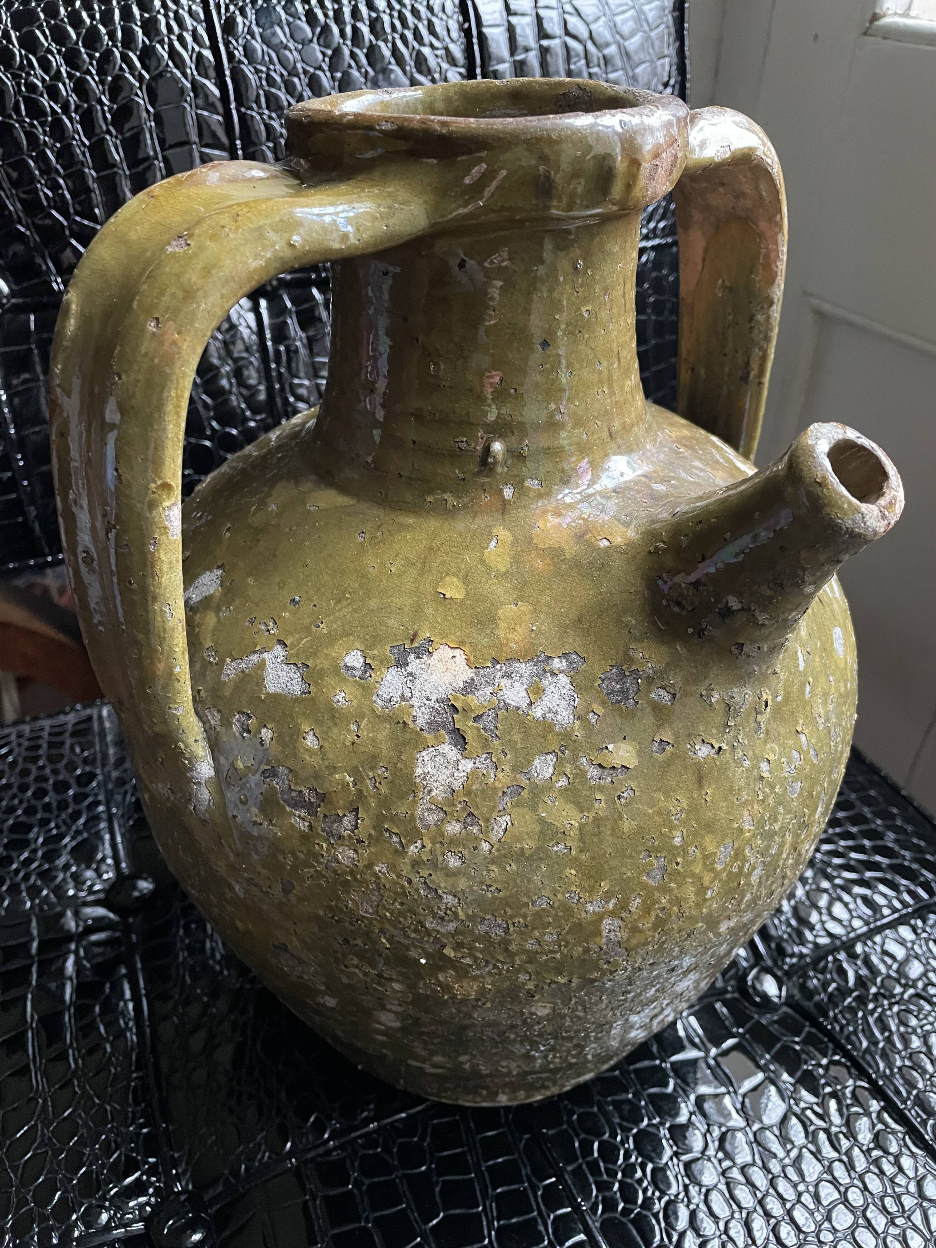 Khaki green glazed terracotta oil jar, 18th-19th century