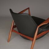 Fauteuil Seal en cuir et teck Ib Kofod-Larsen pour OPE, Suède, années 1960.