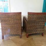 2 colonial-style armchairs in woven rattan and exotic wood