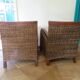2 colonial-style armchairs in woven rattan and exotic wood