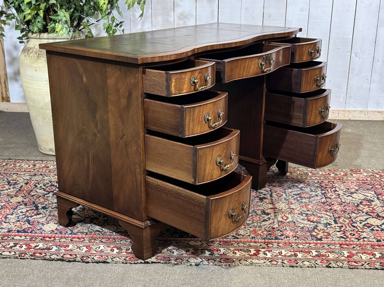 English desk from the 1950s in mahogany with a leather top.
