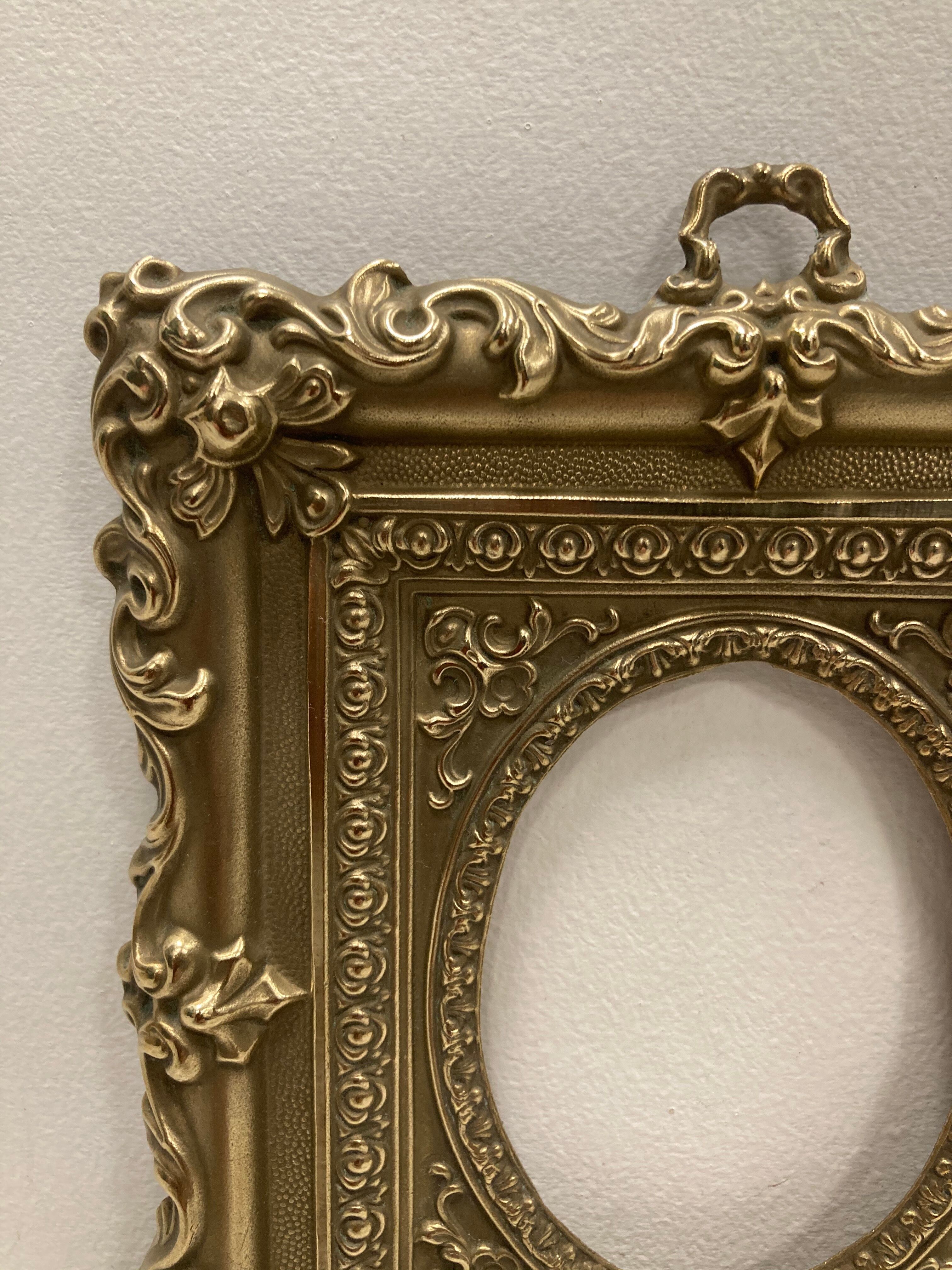 Pair of brass photo frames