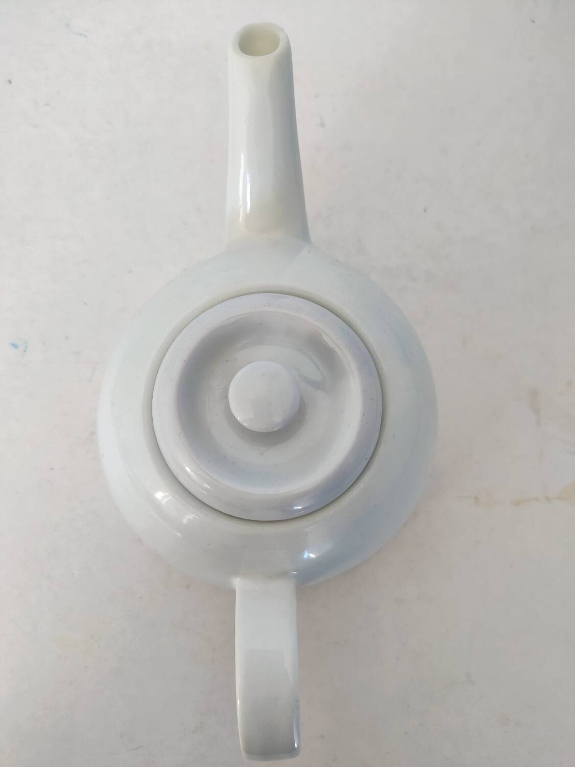 Small white porcelain teapot