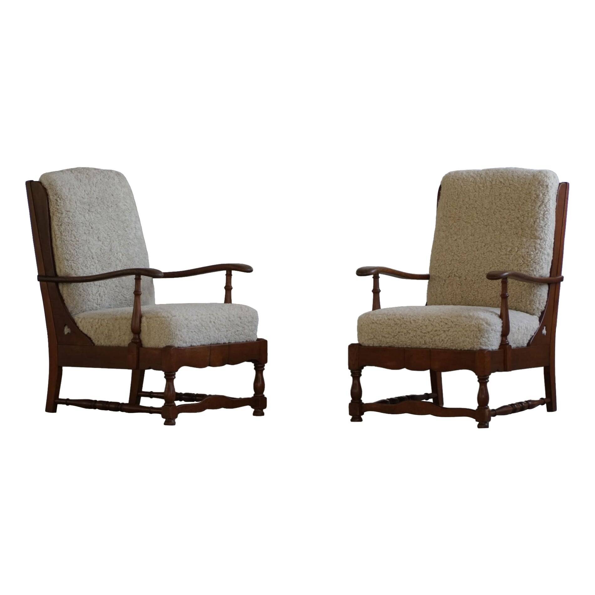 Modern Danish design, a pair of high-backed armchairs in oak and lambswool, 1950s.