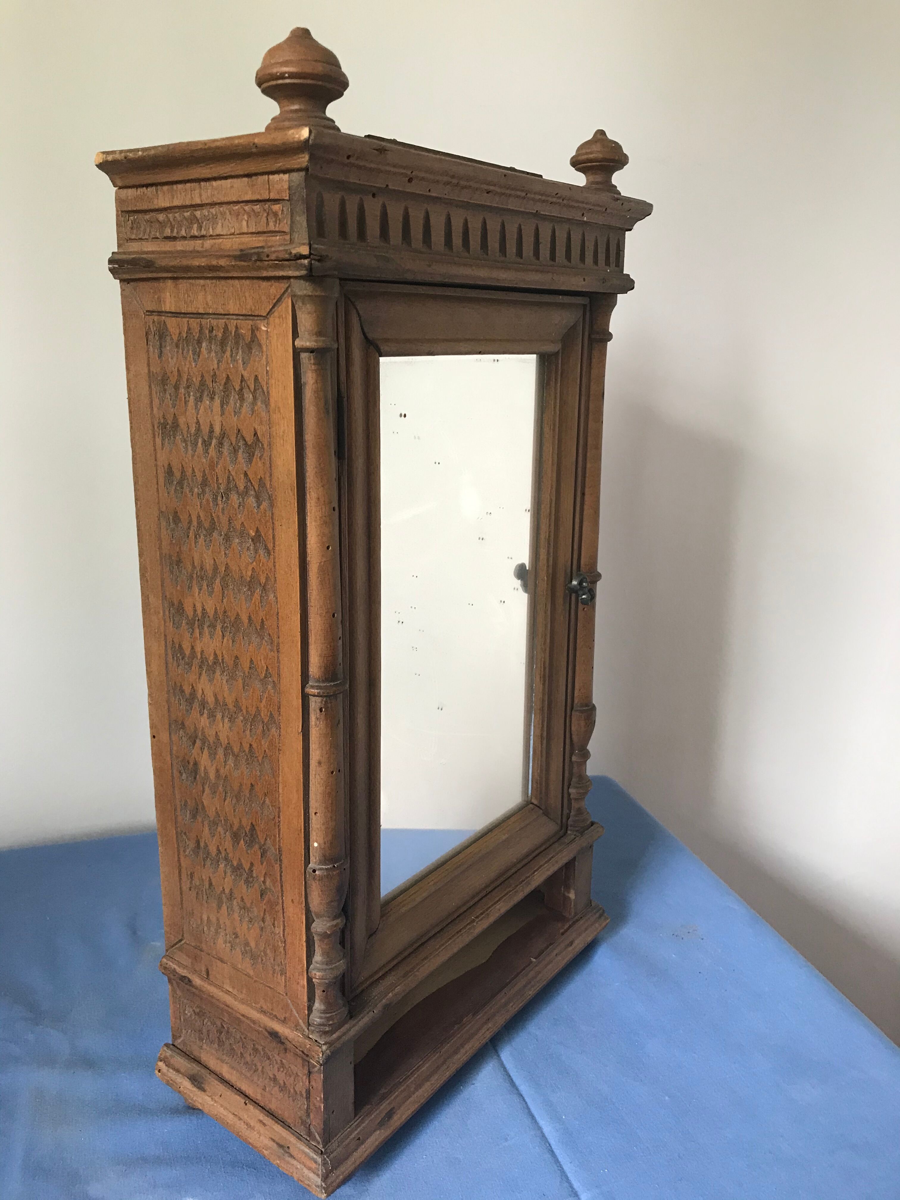 Ancient doll cabinet