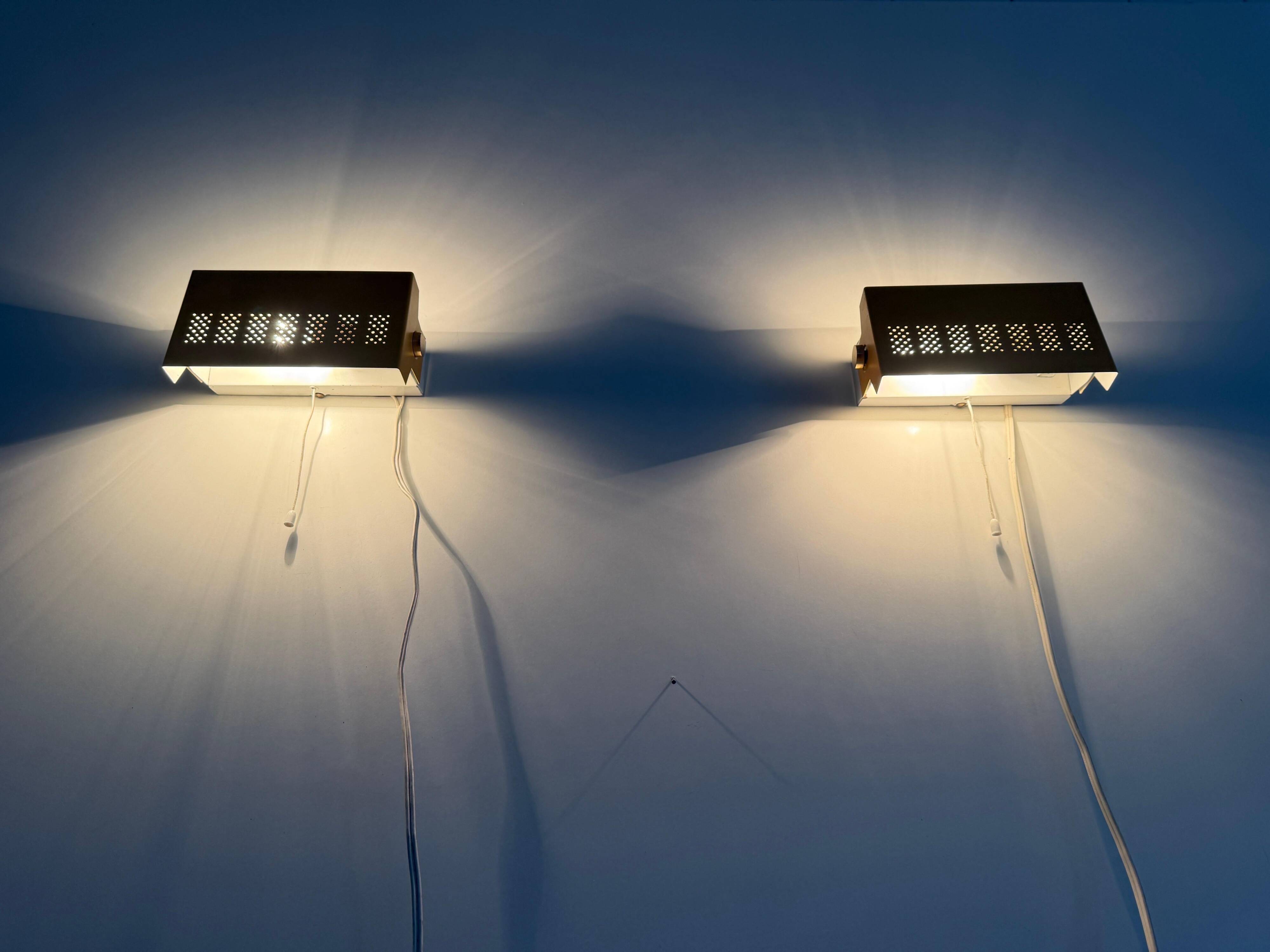 Pair of yellow metal wall lights from the mid-century by N Leuchten, 1960s, Germany.