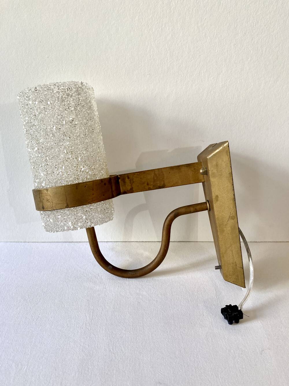 Set of three wall sconces in gold metal and ice effect Perspex, 1960-70.