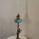Large kerosene lamp mounted on bronze statue. Late nineteenth century