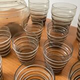Service of glasses, cups, decanters of the 50s in smoked glass